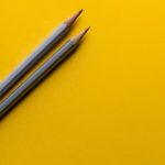Pencils on a yellow background. Photo by Joanna Kosinska on Unsplash